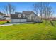 Stunning two-story home featuring a three-car garage and a well-manicured lawn at 12536 Lowery Way, Fishers, IN 46037