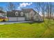 Stunning two-story home featuring a three-car garage and a well-manicured lawn at 12536 Lowery Way, Fishers, IN 46037