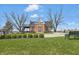 Charming exterior view of a School House Cafe, features a brick facade, outdoor seating and landscaping at 12536 Lowery Way, Fishers, IN 46037