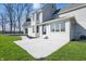 View of the backyard featuring a patio, well maintained lawn and large windows at 12536 Lowery Way, Fishers, IN 46037