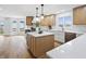 Well-lit kitchen featuring custom cabinets, stainless steel appliances, and a marble island at 12536 Lowery Way, Fishers, IN 46037
