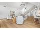 Open living room with a staircase, hardwood floors, and stylish decor at 12536 Lowery Way, Fishers, IN 46037
