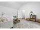 Cozy living room with neutral furniture, carpet, and a decorative plant at 12536 Lowery Way, Fishers, IN 46037