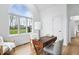 This home office has a large arched window, hardwood floors, and a lovely desk setup at 12536 Lowery Way, Fishers, IN 46037