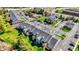 An aerial view captures the entire property including the community pool and parking at 12588 Tennyson Ln # 205, Carmel, IN 46032