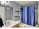 Bathroom featuring a vanity with solid surface top, mirror, and a shower with curtain at 12588 Tennyson Ln # 205, Carmel, IN 46032