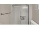 Bathroom with shower featuring sliding glass doors and chrome hardware at 12588 Tennyson Ln # 205, Carmel, IN 46032