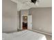 Large bedroom featuring ceiling fan and views of the dining room at 12588 Tennyson Ln # 205, Carmel, IN 46032