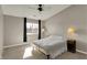 Cozy bedroom with ceiling fan, natural light, and neutral decor at 12588 Tennyson Ln # 205, Carmel, IN 46032