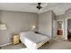 Spacious bedroom with neutral walls, and access to bathroom at 12588 Tennyson Ln # 205, Carmel, IN 46032