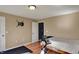Bedroom featuring hardwood floors, a bed, gym equipment and a closet at 12588 Tennyson Ln # 205, Carmel, IN 46032