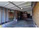 Garage provides parking space and storage, featuring an American flag and mirror at 12588 Tennyson Ln # 205, Carmel, IN 46032