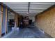 Garage provides parking space and storage, featuring an American flag and mirror at 12588 Tennyson Ln # 205, Carmel, IN 46032