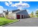 Exterior shot of garages showcasing ample parking in a well-maintained community at 12588 Tennyson Ln # 205, Carmel, IN 46032