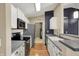 Contemporary kitchen featuring stainless steel appliances and sleek countertops at 12588 Tennyson Ln # 205, Carmel, IN 46032