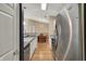 Kitchen offers an open concept with views to the dining area and stainless steel appliances at 12588 Tennyson Ln # 205, Carmel, IN 46032