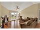 Inviting living room featuring hardwood floors, a fireplace, and access to a private balcony at 12588 Tennyson Ln # 205, Carmel, IN 46032