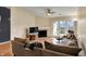 Inviting living room with fireplace, television, and comfortable, neutral decor at 12588 Tennyson Ln # 205, Carmel, IN 46032