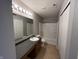 Well-lit bathroom with tub, shower, and vanity at 12657 Republic Dr, Fishers, IN 46037