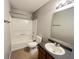 Functional bathroom featuring shower-tub combo and laminate floors at 12657 Republic Dr, Fishers, IN 46037