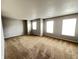 A spacious bedroom filled with natural light, neutral walls, and comfortable carpet at 12657 Republic Dr, Fishers, IN 46037