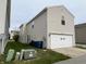 Exterior view of home with siding, driveway, and attached garage at 12657 Republic Dr, Fishers, IN 46037