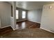 Inviting living room featuring hardwood floors, large windows, and neutral paint at 12657 Republic Dr, Fishers, IN 46037