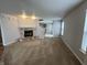 Spacious living room featuring a stone fireplace and neutral colored walls at 12657 Republic Dr, Fishers, IN 46037