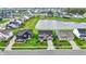 Aerial view showcasing community homes, pond with fountain, and green spaces, highlighting an attractive neighborhood layout at 132 Oakhurst Way, Westfield, IN 46074