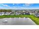 Beautiful aerial view of homes surrounding a pond with fountain in a well maintained community at 132 Oakhurst Way, Westfield, IN 46074