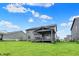 Spacious backyard featuring a covered porch and well-kept lawn, perfect for outdoor entertaining and relaxation at 132 Oakhurst Way, Westfield, IN 46074