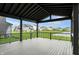 Large, covered deck offers picturesque views of the backyard and surrounding neighborhood at 132 Oakhurst Way, Westfield, IN 46074