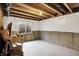 Unfinished basement with a window and visible ceiling beams, ready for customization at 132 Oakhurst Way, Westfield, IN 46074
