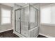 Bright bathroom featuring a glass-enclosed shower with tile walls, tile floors, and natural light at 132 Oakhurst Way, Westfield, IN 46074