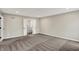 Spacious bedroom featuring neutral walls, carpeted floors, backyard views, and an ensuite bathroom at 132 Oakhurst Way, Westfield, IN 46074