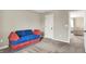 Bedroom featuring plush carpeting and a bright blue and red couch at 132 Oakhurst Way, Westfield, IN 46074