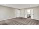 Spacious bedroom featuring neutral walls, carpeted floors, backyard views, and an ensuite bathroom at 132 Oakhurst Way, Westfield, IN 46074