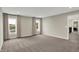 Bright bedroom with neutral walls, carpeted floors, large windows, and backyard views at 132 Oakhurst Way, Westfield, IN 46074