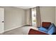 Bedroom featuring plush carpeting, a neutral color scheme, and a large window with curtains at 132 Oakhurst Way, Westfield, IN 46074