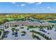 Aerial view of clubhouse with parking, landscaping, and sports facilities at 132 Oakhurst Way, Westfield, IN 46074