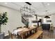 Dining room with table, chairs, and modern lighting fixture next to the kitchen at 132 Oakhurst Way, Westfield, IN 46074
