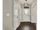 Inviting entryway with beautiful flooring, stylish light fixture, and convenient access to other rooms at 132 Oakhurst Way, Westfield, IN 46074