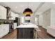 Kitchen with a large island, stainless steel appliances, and modern lighting at 132 Oakhurst Way, Westfield, IN 46074