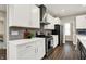 Modern kitchen featuring stainless steel appliances, light countertops, and wood flooring at 132 Oakhurst Way, Westfield, IN 46074