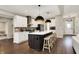 Spacious kitchen with island seating, stainless appliances, and stylish pendant lights at 132 Oakhurst Way, Westfield, IN 46074