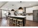 Open concept kitchen with island, stainless steel appliances, and seating at 132 Oakhurst Way, Westfield, IN 46074