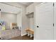 Convenient mudroom with built-in storage cabinets, coat hooks, and a bench, accessible from the bonus room at 132 Oakhurst Way, Westfield, IN 46074