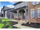 Relax on this covered front porch, complete with rocking chairs for an inviting and cozy outdoor space at 132 Oakhurst Way, Westfield, IN 46074