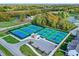 Aerial view of tennis courts, clubhouse, manicured lawn and landscaping at 132 Oakhurst Way, Westfield, IN 46074