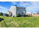 View of backyard with full lawn, fenced in, and featuring a trampoline at 1330 Redwood Dr, Greenfield, IN 46140